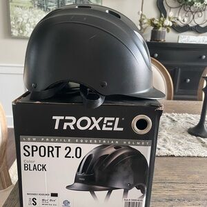 Troxel youth horseback riding helmet size small, black color.
